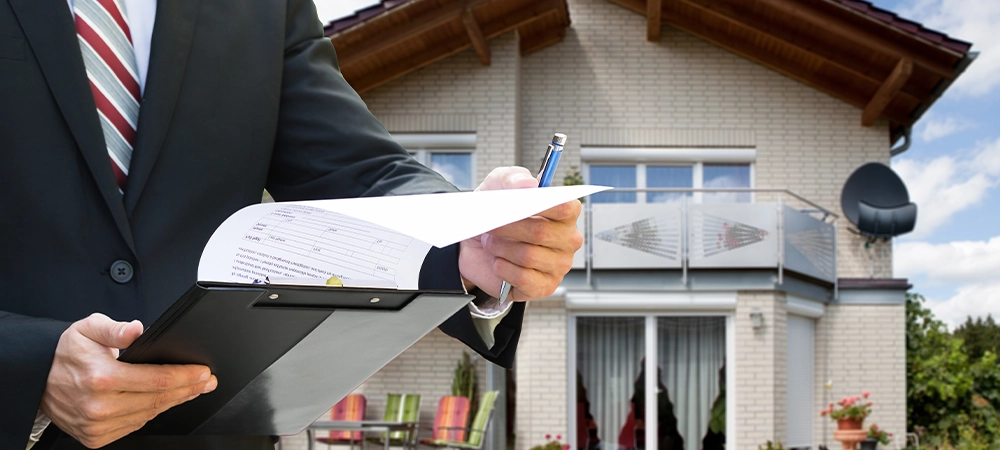 insurance agent inspecting home condition